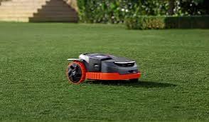 Segway Navimow mower cutting grass on a finished lawn